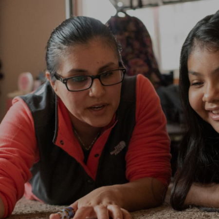 And adult and child working on a project together