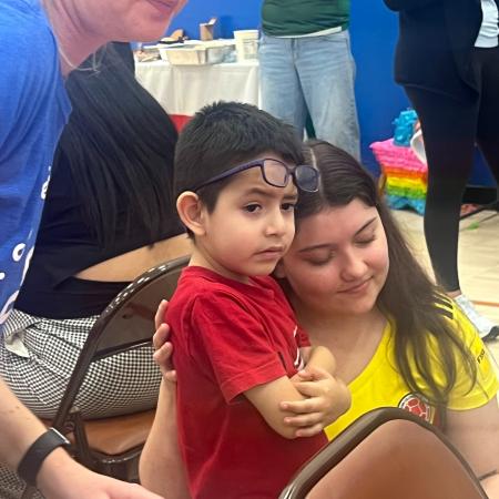 latina clinician with child