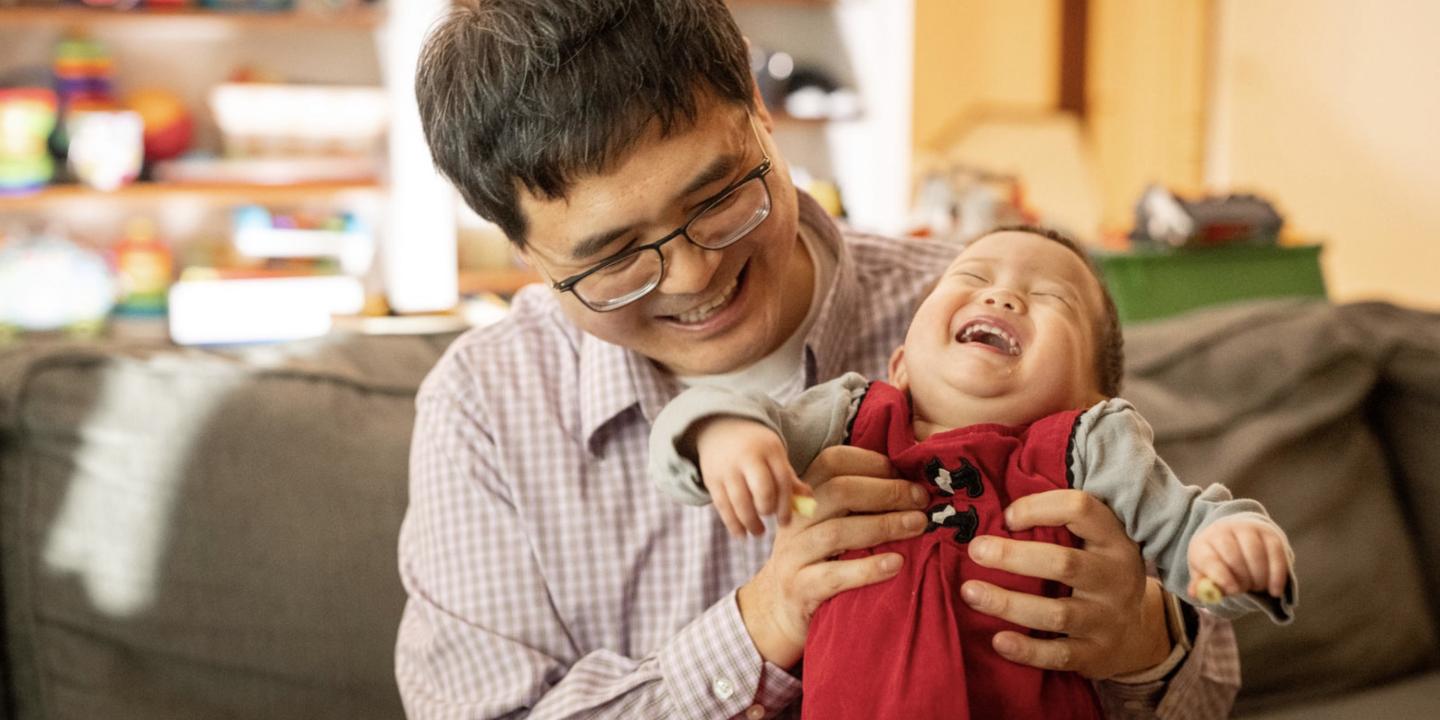 Man with laughing baby