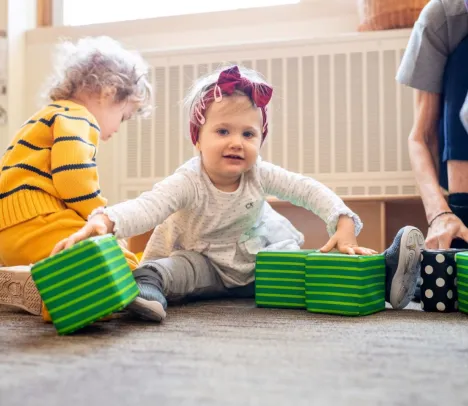 A child playing with square toys