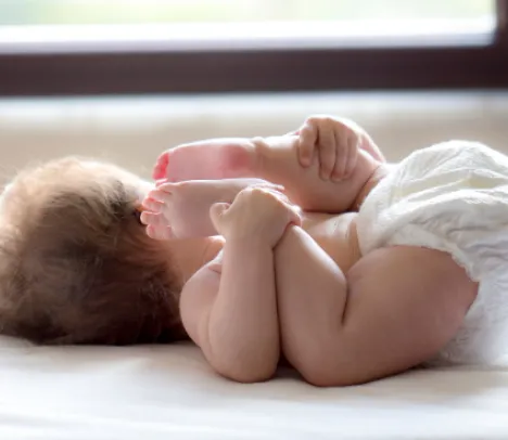A baby laying on its back