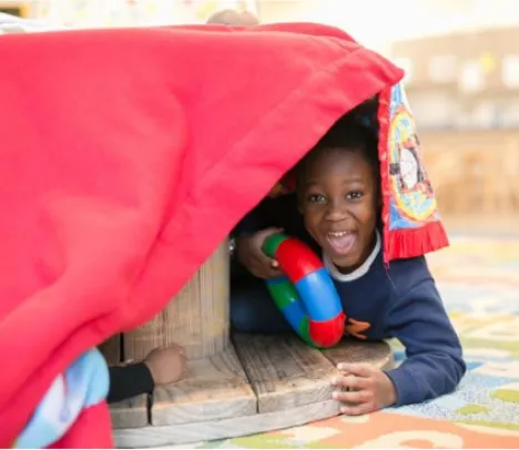 A child playing in a fort