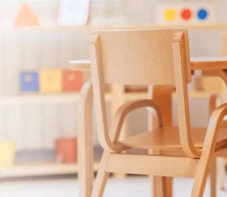 A chair and desk in a classroom