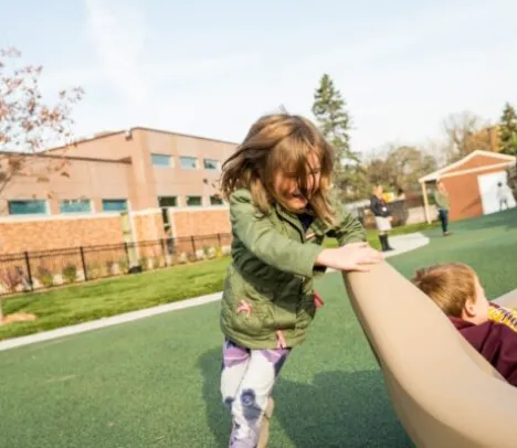 Two children playing at a playground