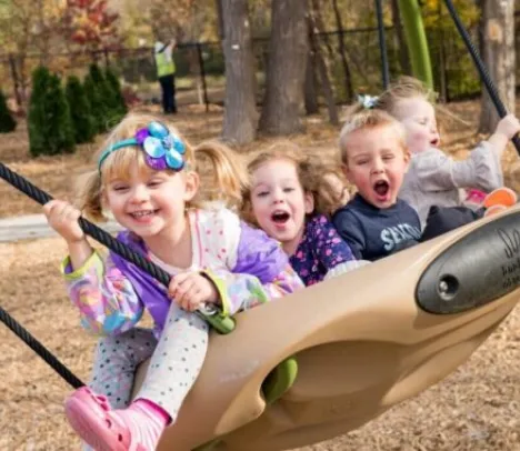 A group of children on a swing