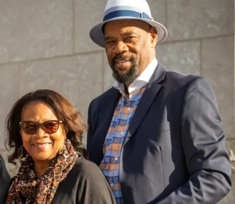 Van Leer smiling at the camera