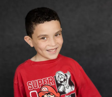 young boy smiling at the camera
