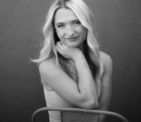 a woman smiles at the camera 