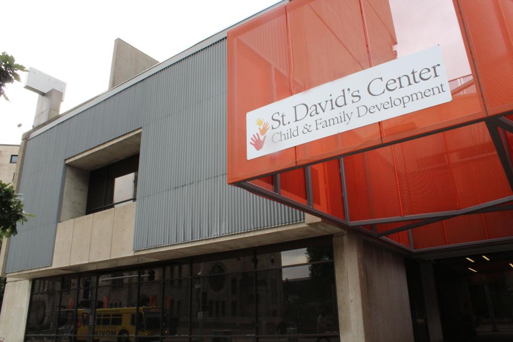 exterior of downtown nicollet center building - a concrete and glass square-ish structure with an orange awning.