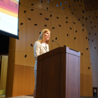 A person giving a presentation at a conference