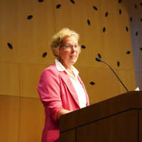 A person giving a presentation at a conference