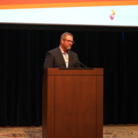 A person giving a presentation at a conference