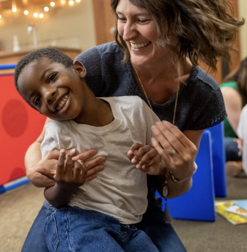 Woman playing with child