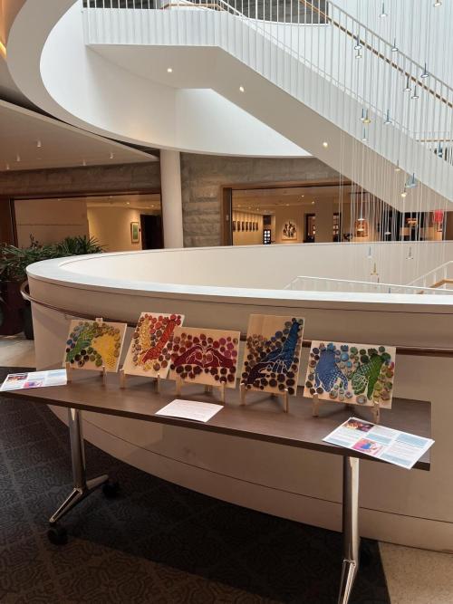 A lobby with art on display