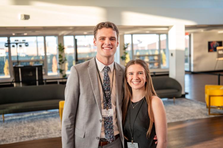 Portrait of man and woman in gala lobby. 