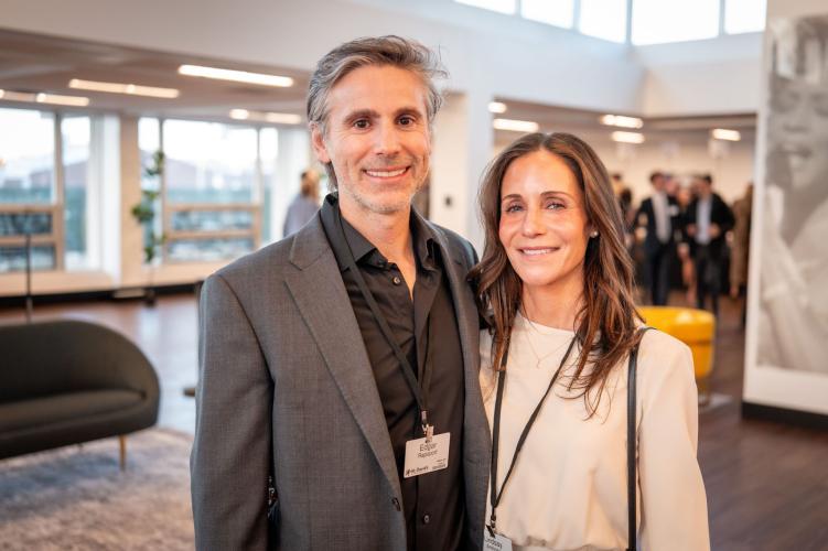 Man and woman in lobby of gala event.