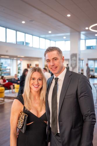 Man and woman in lobby of gala event.
