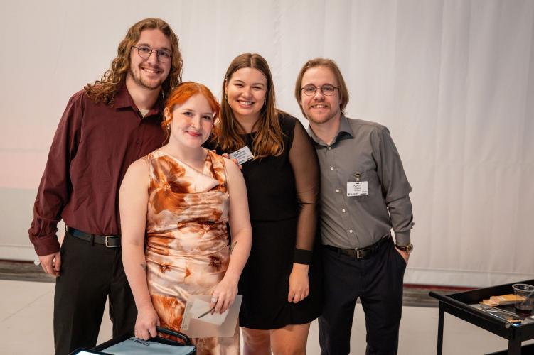 Group of volunteers behind the scenes at gala. 