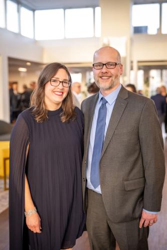 Man and woman in lobby of gala event.