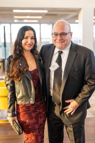 Man and woman in lobby of gala event.