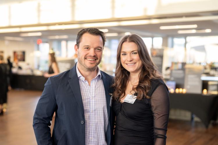 Man and woman in lobby of gala event.
