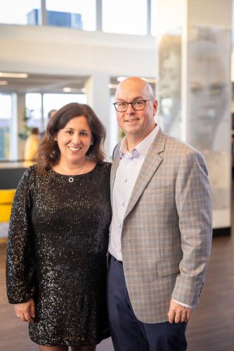 Man and woman in lobby of gala event.