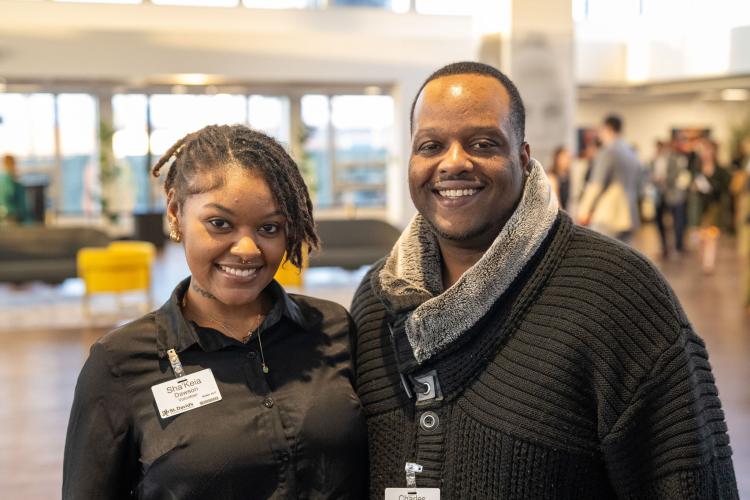 Man and woman in lobby of gala event.