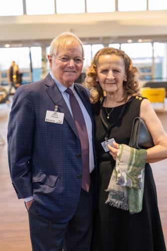 Man and woman in lobby of gala event.