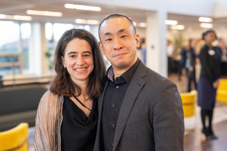 Man and woman in lobby of gala event.