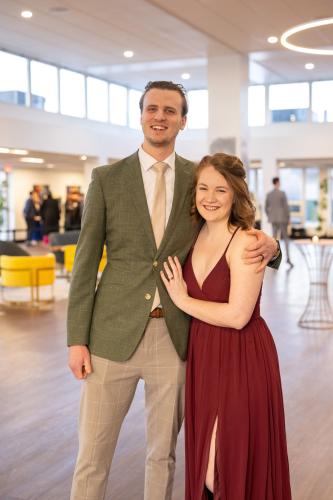 Man and woman in lobby of gala event.