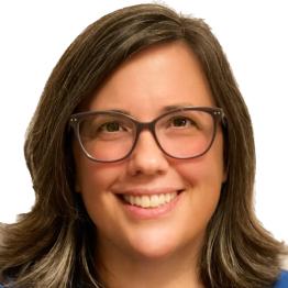Brunette white woman with glasses wearing a royal blue top