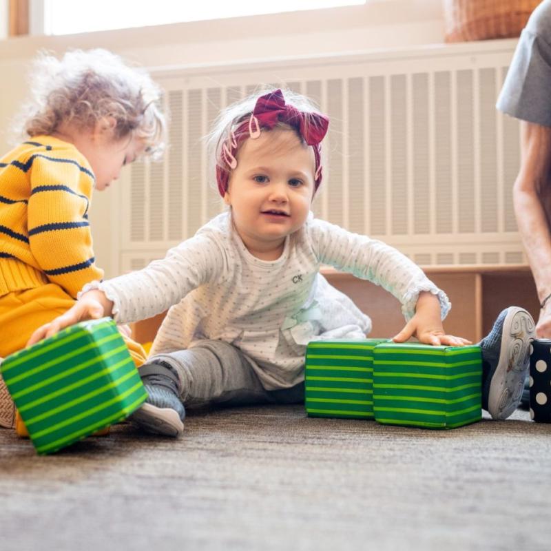 A child playing with square toys