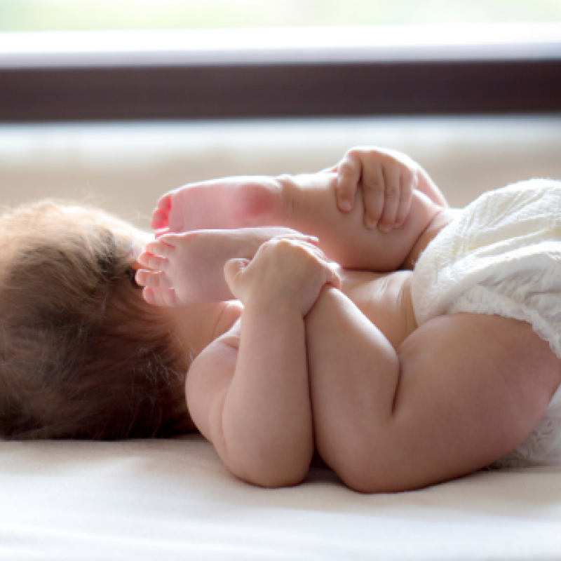 A baby laying on its back