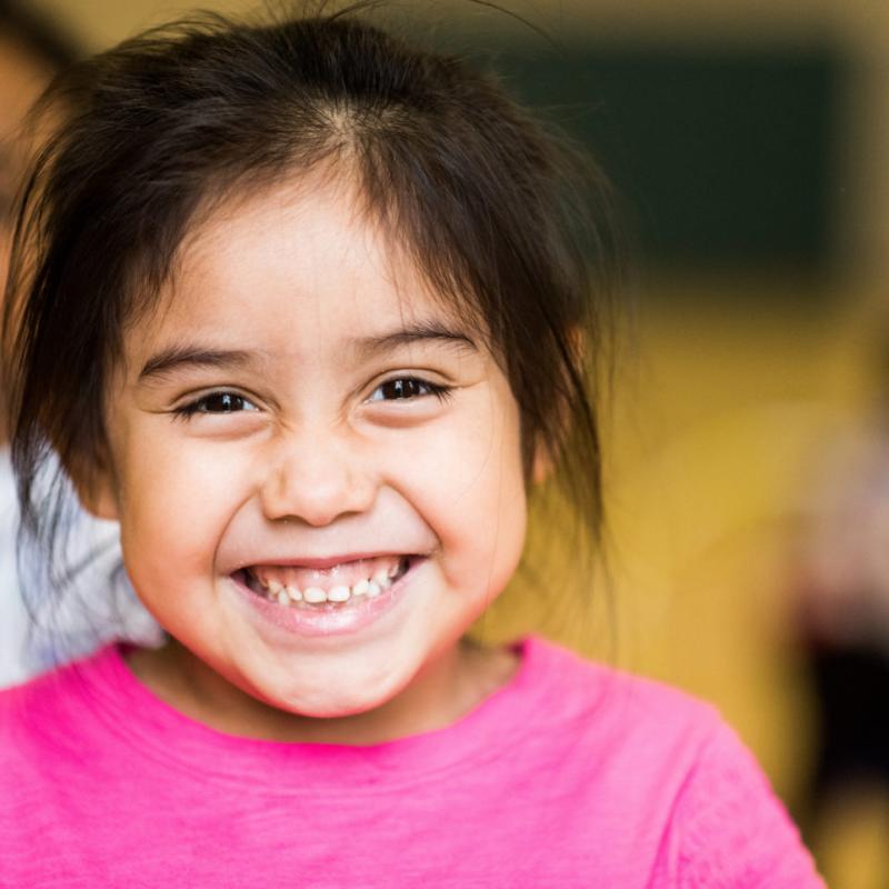 A child smilling at the camera