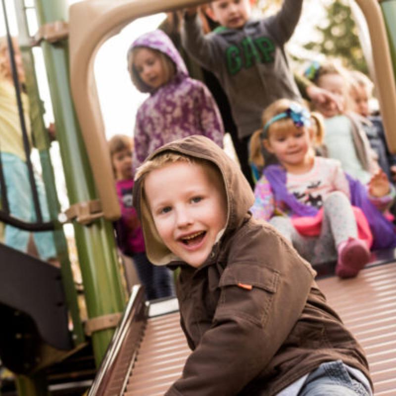 Children playing on a slide