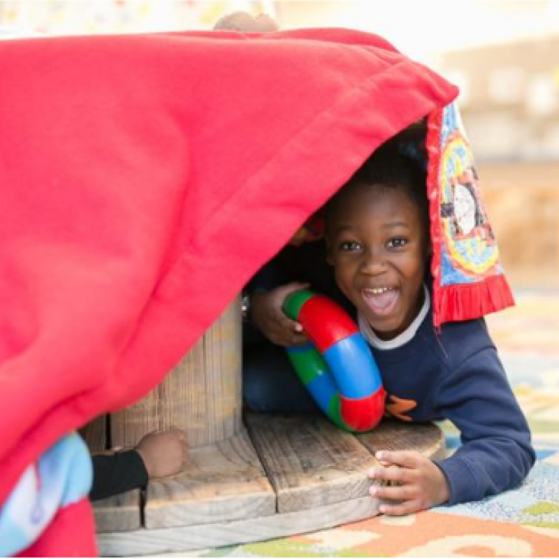 A child playing in a fort