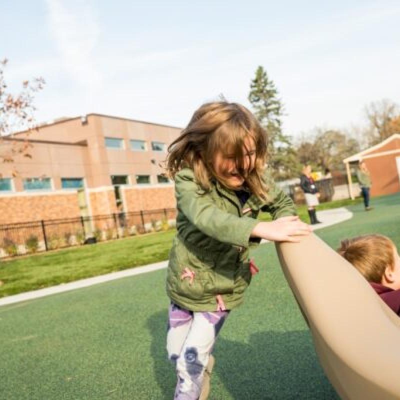 Two children playing at a playground