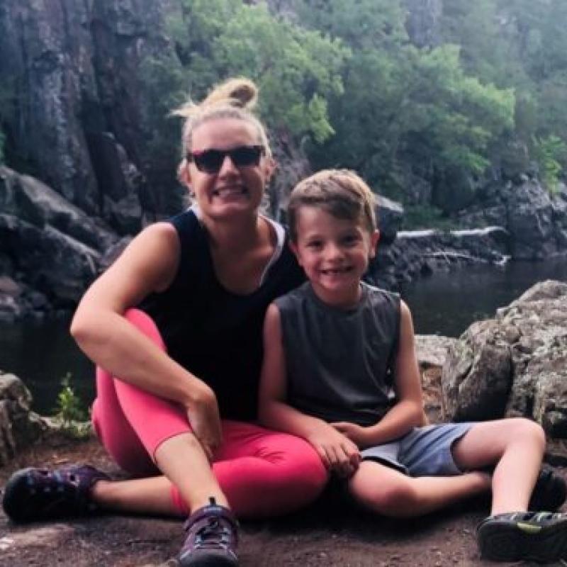 A mother and son smiling