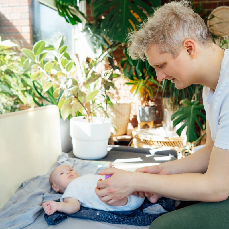 Dad, sitting playing with baby 