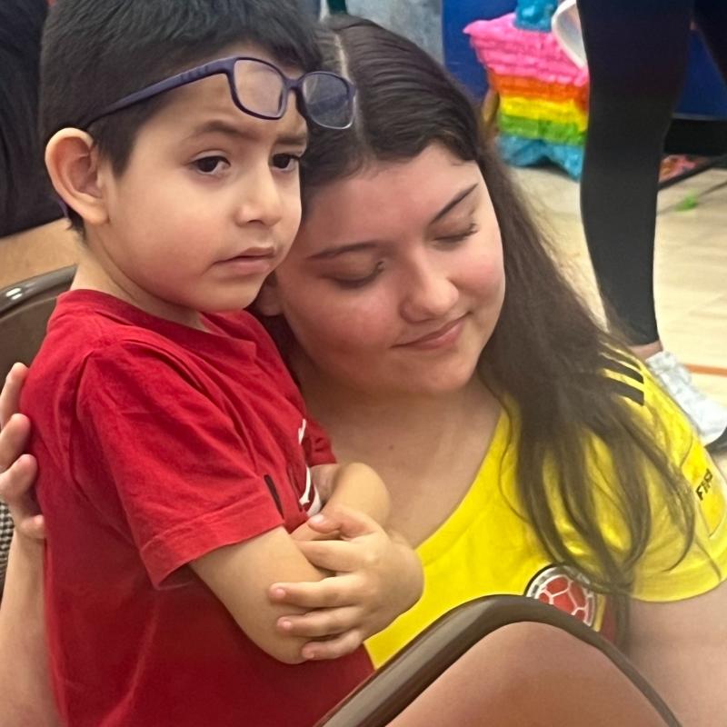 latina clincian with little boy