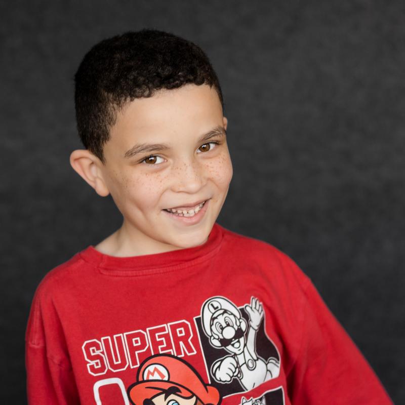 young boy smiling at the camera