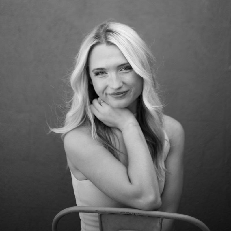 a woman smiles at the camera 